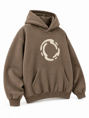 Front three-quarter view of the Soft Orbit washed mocha puff print oversized hoodie