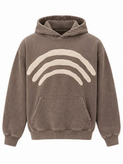 Front view of the Triple Arc washed mocha puff print boxy hoodie with three concentric cream puff-print arcs across the chest above the pocket