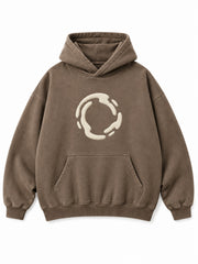 Front view of the Soft Orbit washed mocha puff print oversized hoodie with a small cream broken-orbit puff graphic