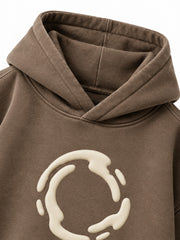 Close-up of the hood and neckline of the Soft Orbit washed mocha puff print oversized hoodie