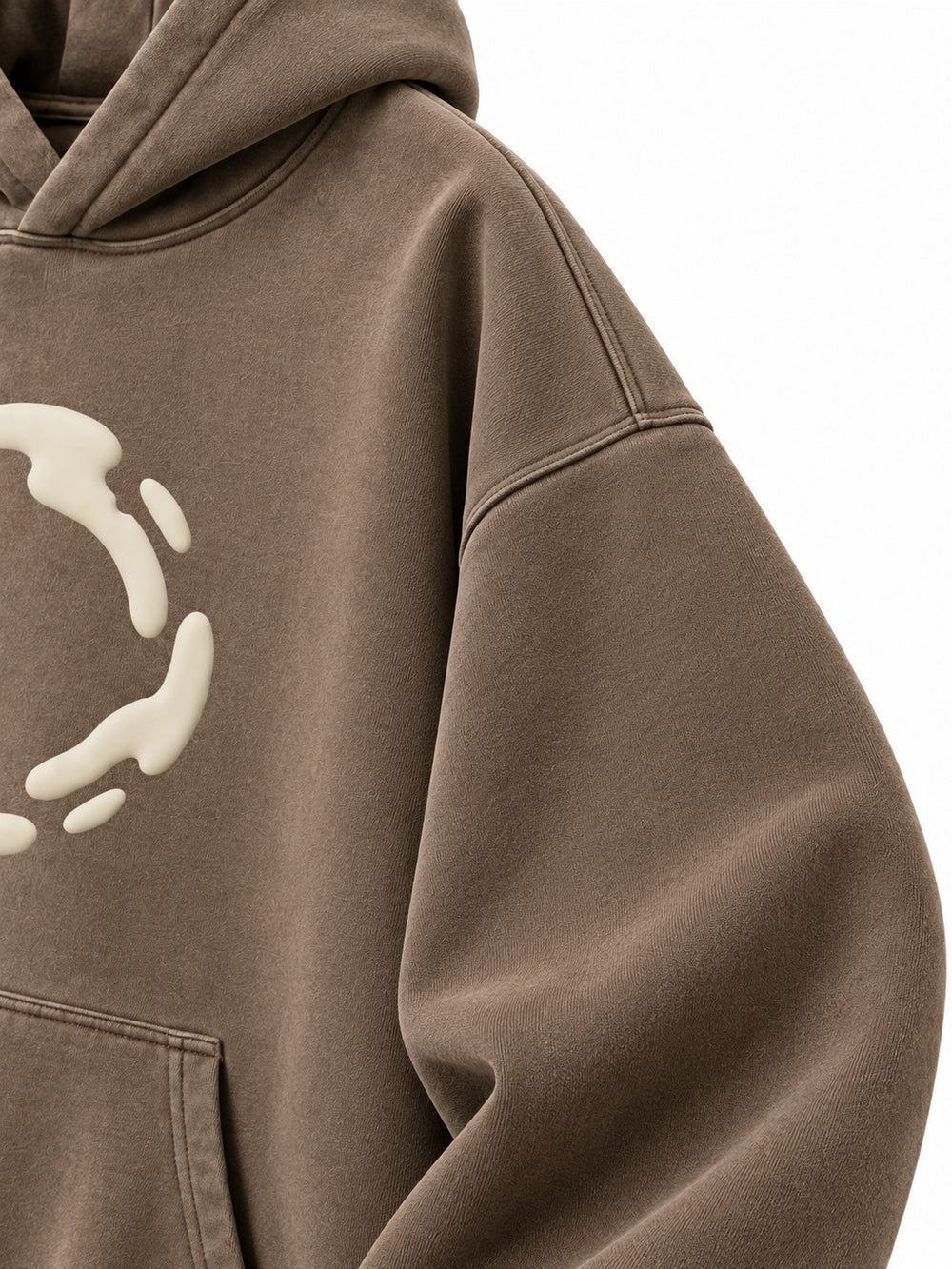 Close-up of the sleeve of the Soft Orbit washed mocha puff print oversized hoodie