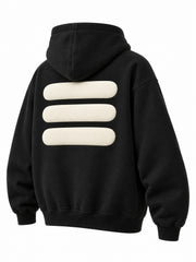 Rear three-quarter view of the Volume black puff print oversized hoodie