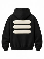 Back view of the Volume black puff print oversized hoodie with three thick cream puff bars below the hood