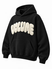 Front three-quarter view of the Volume black puff print oversized hoodie