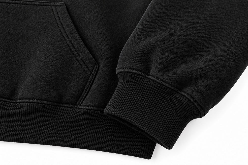 Close-up of the seam stitching of the Volume black puff print oversized hoodie