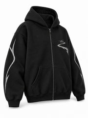 Front three-quarter view of the Night Trail black reflective print zip-up hoodie