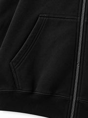 Close-up of the seam stitching of the Night Trail black reflective print zip-up hoodie