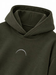 Close-up of the hood and neckline of the Road Arc olive reflective print hoodie