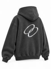 Rear three-quarter view of the Signal Loop charcoal reflective print boxy hoodie
