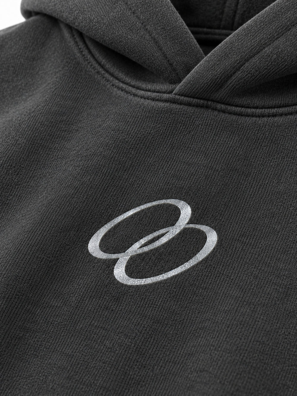 Close-up of the reflective print decoration on the Signal Loop charcoal reflective print boxy hoodie