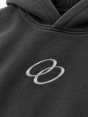 Close-up of the reflective print decoration on the Signal Loop charcoal reflective print boxy hoodie