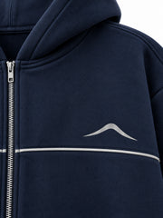 Close-up of the reflective print decoration on the Silver Horizon navy reflective print zip-up hoodie