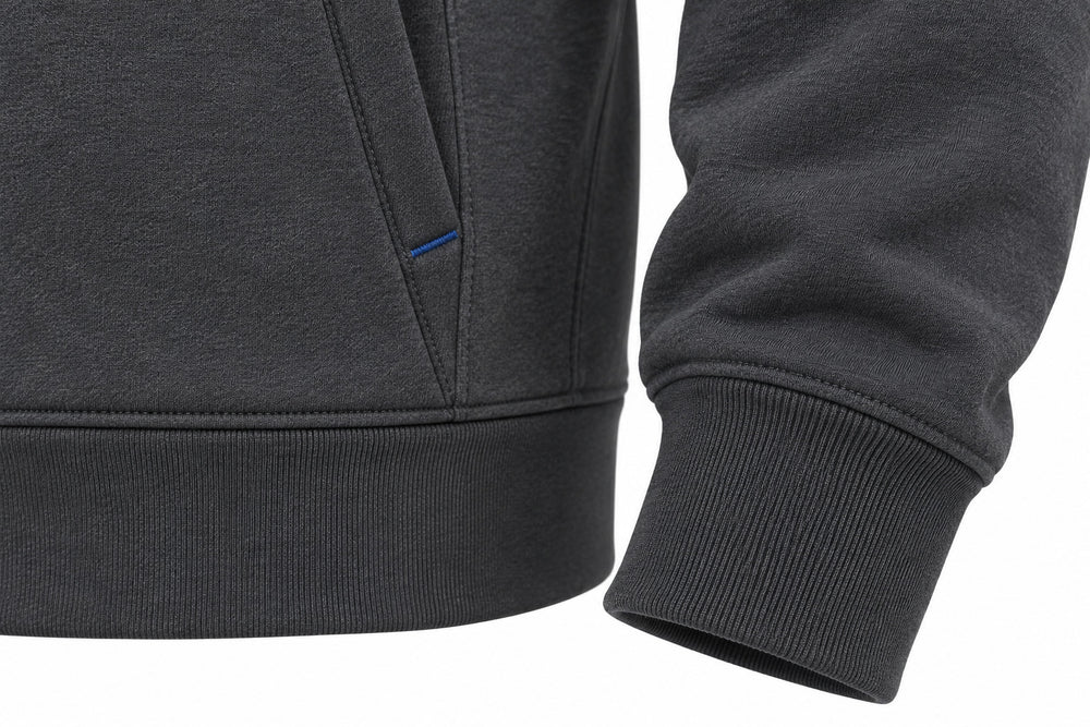 Close-up of the seam stitching of the Transit Quarter Zip charcoal and cobalt reflective print quarter-zip hoodie