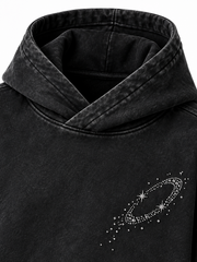 Detail view of the Orbit Constellation washed black rhinestone oversized hoodie