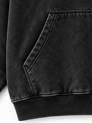 Close-up of the pocket stitching of the Orbit Constellation washed black rhinestone oversized hoodie
