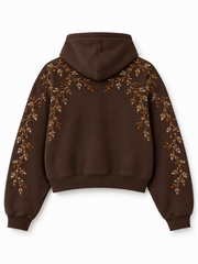 Back view of the Crystal Vine espresso brown rhinestone boxy hoodie with matching amber rhinestone botanical design