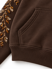 Close-up of the seam stitching of the Crystal Vine espresso brown rhinestone boxy hoodie