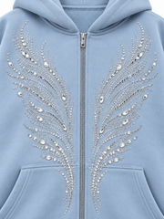 Close-up of the rhinestone decoration on the Ice Wings icy blue rhinestone zip-up hoodie