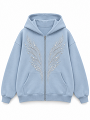 Front view of the Ice Wings icy blue rhinestone zip-up hoodie with silver-tone rhinestone feather wings on either side of the zipper