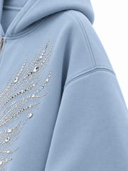 Close-up of the sleeve of the Ice Wings icy blue rhinestone zip-up hoodie
