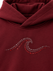 Close-up of the rhinestone decoration on the Ruby Waves burgundy rhinestone oversized hoodie