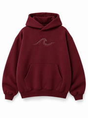 Front view of the Ruby Waves burgundy rhinestone oversized hoodie with a small ruby-tone rhinestone wave at the chest