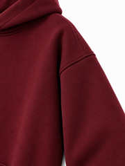 Close-up of the sleeve of the Ruby Waves burgundy rhinestone oversized hoodie