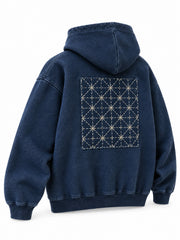 Rear three-quarter view of the Indigo Grid indigo sashiko stitch boxy hoodie
