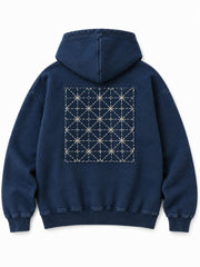 Back view of the Indigo Grid indigo sashiko stitch boxy hoodie with a large geometric grid of visible sashiko-style stitching