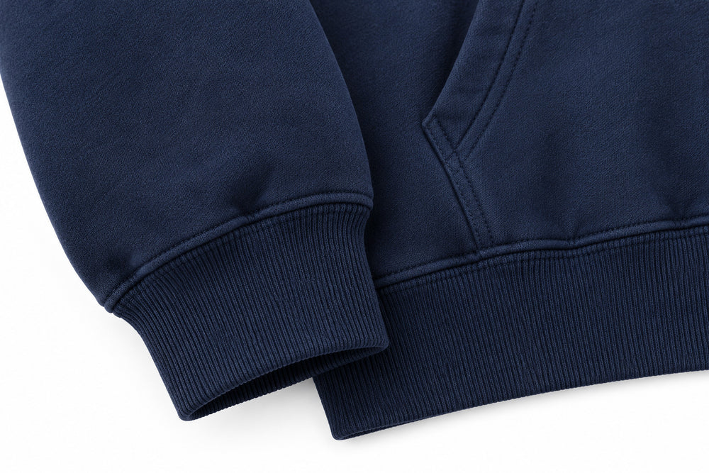 Close-up of the seam stitching of the Coast Club navy screen print hoodie