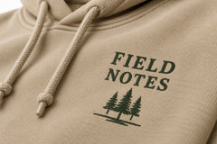 Close-up of the screen print decoration on the Field Notes khaki screen print hoodie