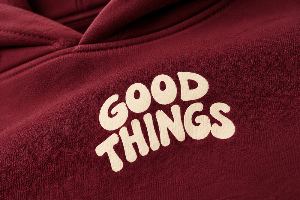 Close-up of the screen print decoration on the Good Things burgundy screen print oversized hoodie