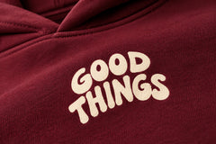 Close-up of the screen print decoration on the Good Things burgundy screen print oversized hoodie