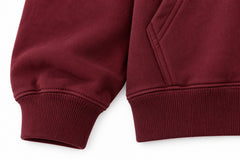 Close-up of the seam stitching of the Good Things burgundy screen print oversized hoodie