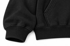 Close-up of the seam stitching of the Open Road black screen print oversized hoodie