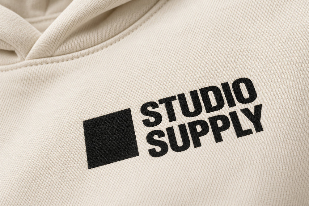Close-up of the screen print decoration on the Studio Supply ecru screen print boxy hoodie