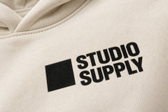 Close-up of the screen print decoration on the Studio Supply ecru screen print boxy hoodie