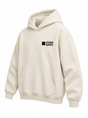 Front three-quarter view of the Studio Supply ecru screen print boxy hoodie