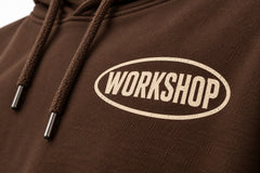 Close-up of the screen print decoration on the Workshop brown screen print hoodie