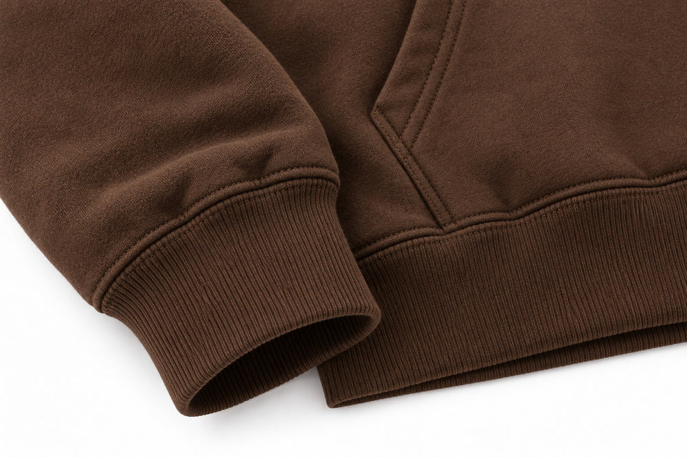 Close-up of the seam stitching of the Workshop brown screen print hoodie