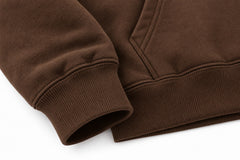 Close-up of the seam stitching of the Workshop brown screen print hoodie