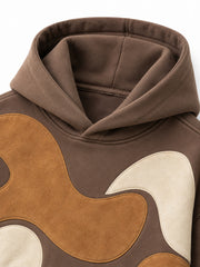 Close-up of the hood and neckline of the Suede Shapes mocha suede-look appliqué oversized hoodie