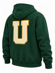 Rear three-quarter view of the Athletic Union forest green twill appliqué hoodie