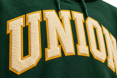 Close-up of the twill appliqué decoration on the Athletic Union forest green twill appliqué hoodie