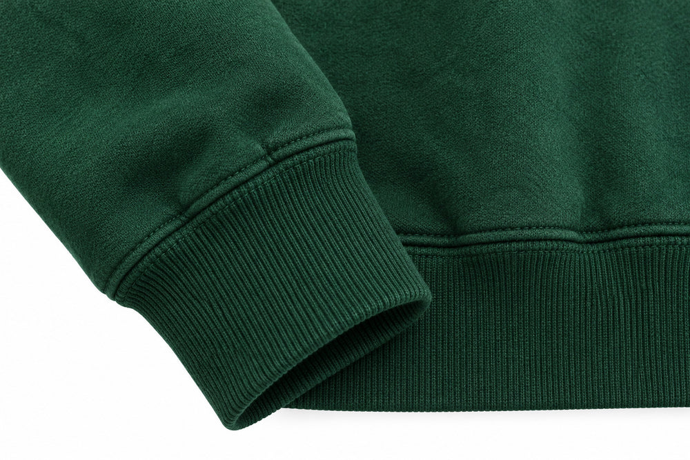 Close-up of the seam stitching of the Athletic Union forest green twill appliqué hoodie