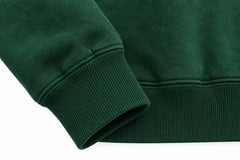 Close-up of the seam stitching of the Athletic Union forest green twill appliqué hoodie