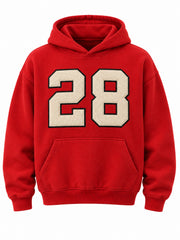 Front view of the Racing Twill red twill appliqué boxy hoodie with large cream 28 tackle-twill numeral with a black stitched outline above the pocket