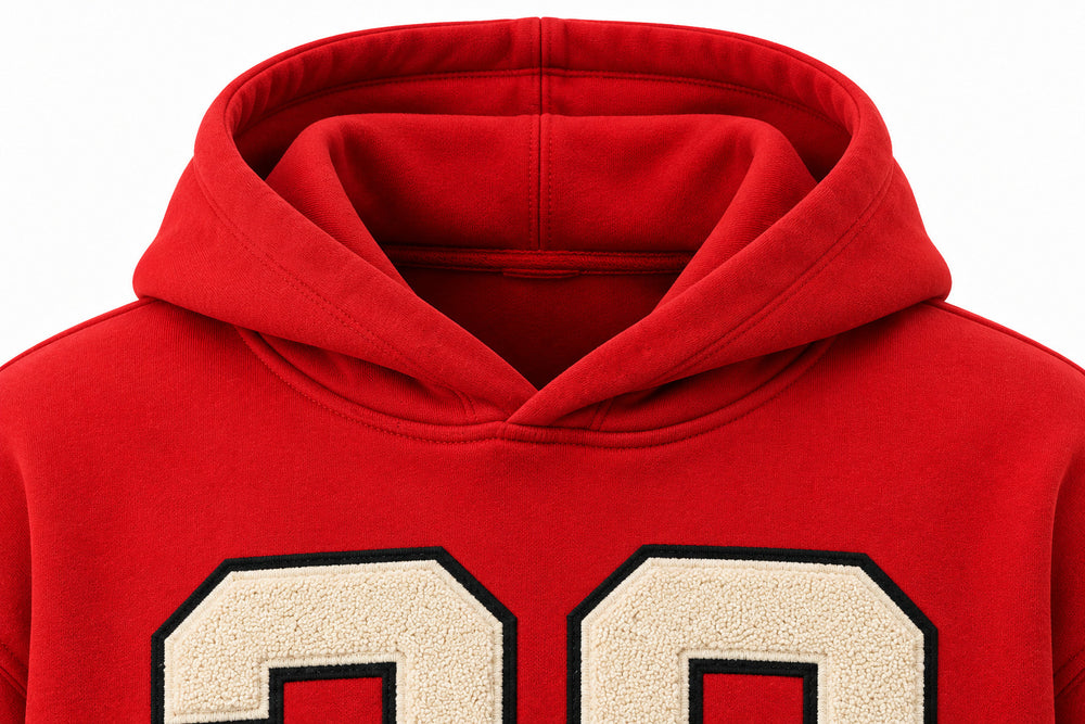 Close-up of the hood and neckline of the Racing Twill red twill appliqué boxy hoodie