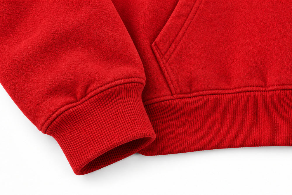 Close-up of the seam stitching of the Racing Twill red twill appliqué boxy hoodie