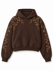 Front view of the Crystal Vine espresso brown rhinestone boxy hoodie with amber rhinestone vines across the shoulders and down the sleeves